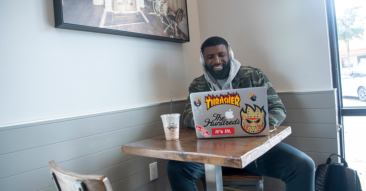 Student Studying with Headphones