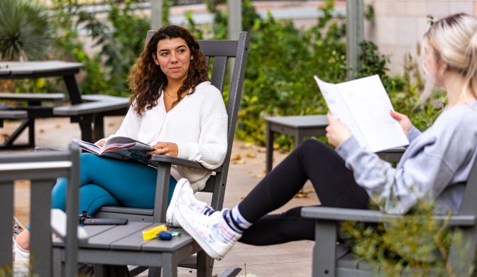 A pair of Concordia students studying on campus.