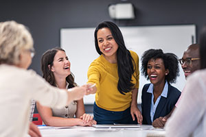 This image depicts a manager leading a business strategy meeting.