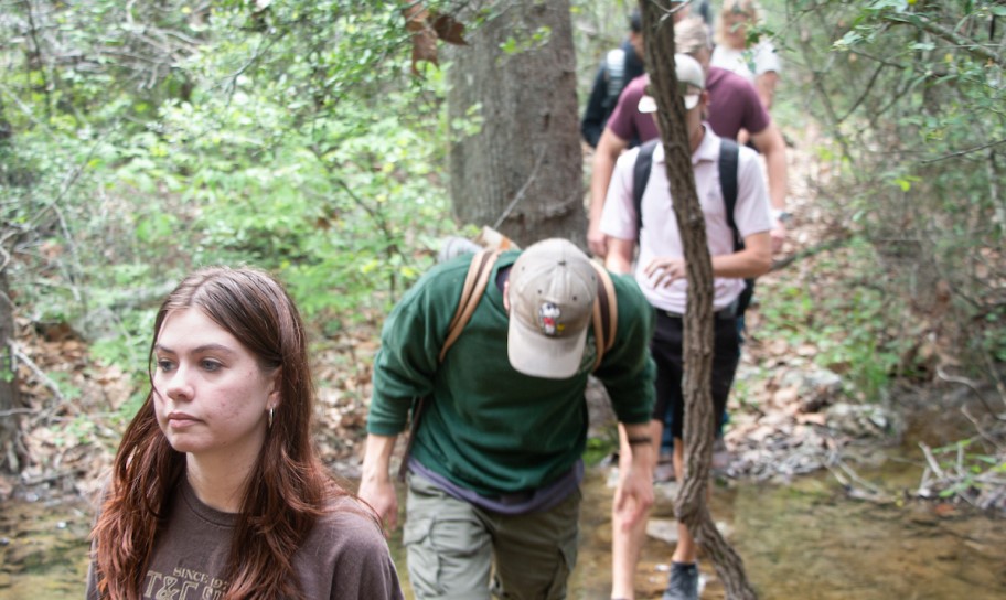 A group of students touring the natural preserve on campus