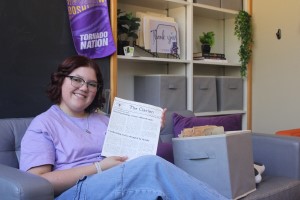 Abby Shaivitz reading an article from The Clarion