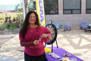 CTX student giving out swag with a prize wheel