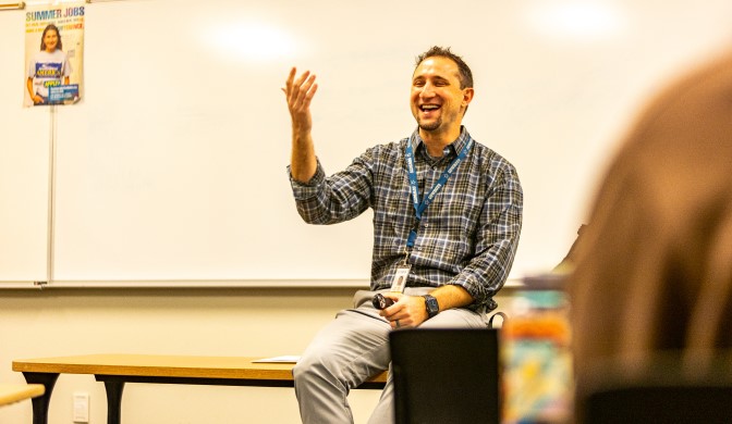 A professor and class enjoying the lesson