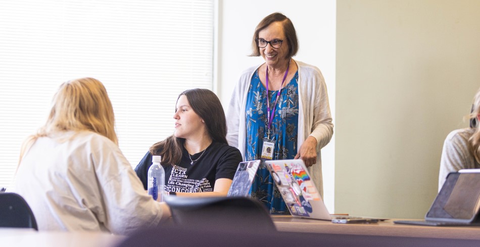 A professor answering questions from students in class