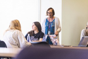 A professor answering questions from students in class