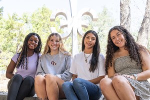 A group of female students in front of the campus Cruciform