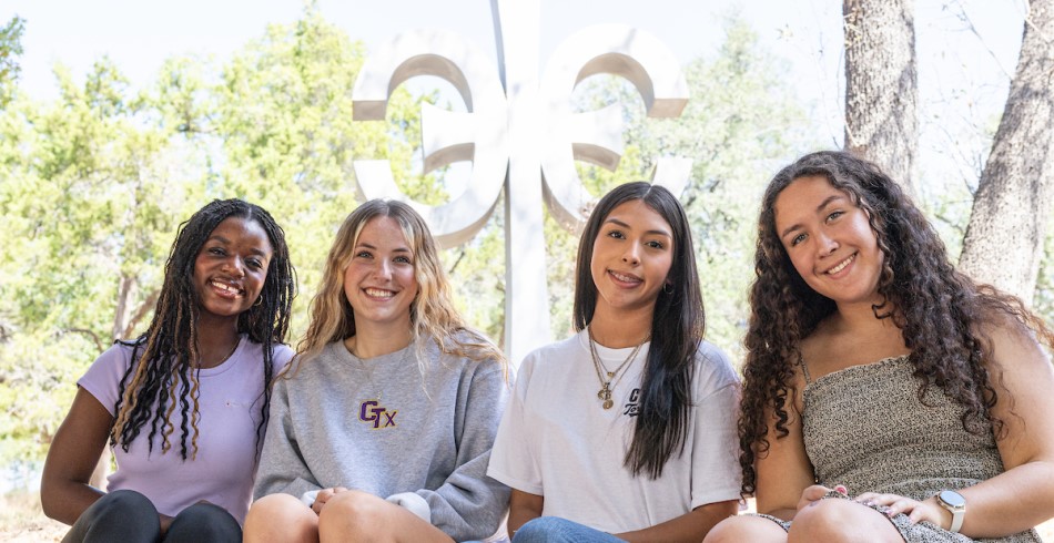 A group of female students in front of the campus Cruciform