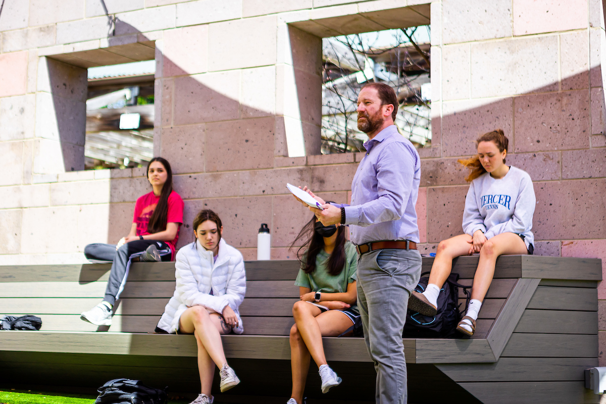 Faculty an students in a discussion