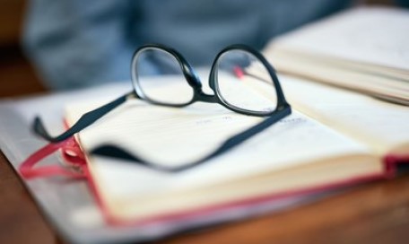 Glasses on a stack of books