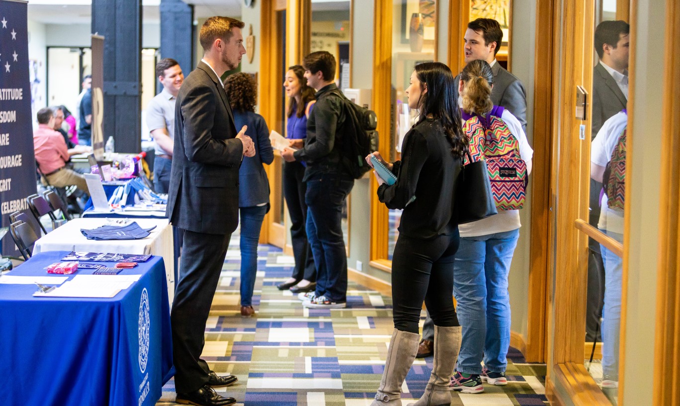 A group of professionals at a career fair